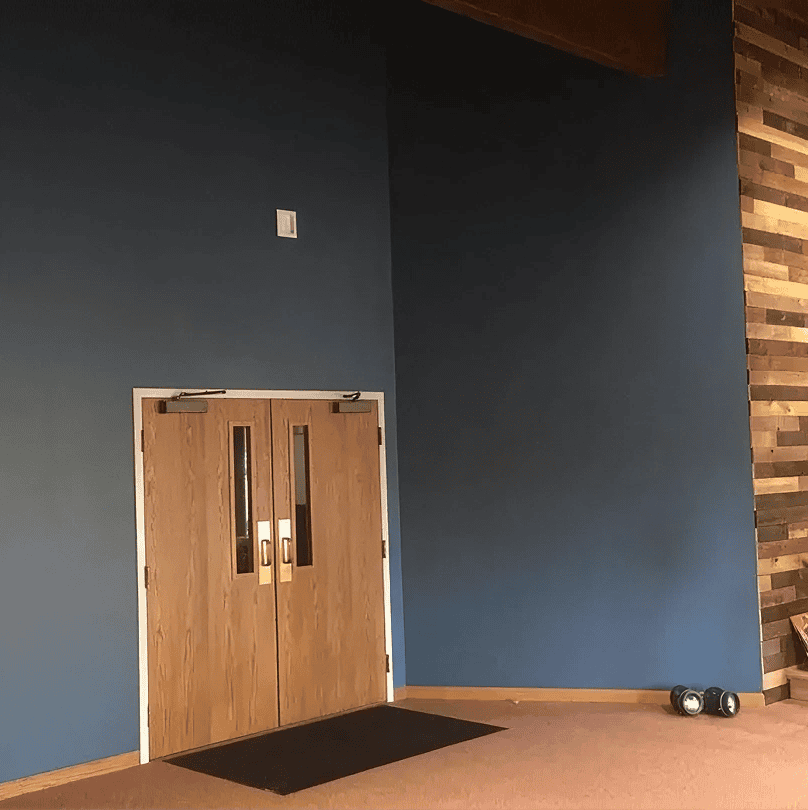 Wooden doors against blue wall interior