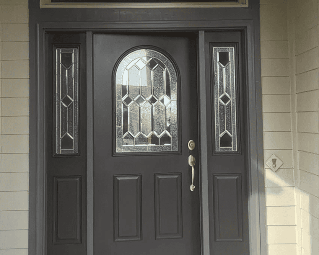 Elegant entry door with sidelights.